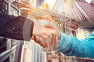 Double exposure of businessman handshake on New York City Wall Street background