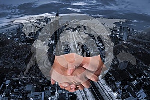 Double Exposure of a businessman handshake on World Global Cartography Globalization ,Bangkok cityscape in business district blue