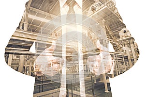 Double exposure of businessman with Industrial equipment Factory