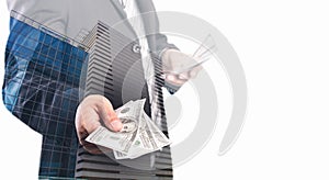 Double exposure of Businessman with money in hand with cityscape blurred building background, US dollar USD bills - investment,