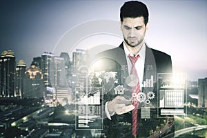 Double exposure of businessman and skyscraper photo