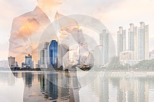 Double Exposure of Businessman in Suit with City Background Illustrating Business Leadership Concept