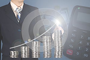 Double exposure businessman touching financial chart with piles