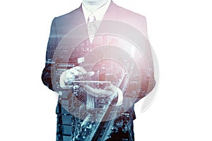 Double Exposure of Businessman use Digital Device Tablet with Modern Business Metropolitan City