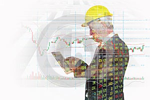 Double Exposure of Businessman use Wireless Digital Tablet Application connect with Candlestick and Bar graph