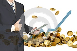 Double exposure of businessman using tablet to manage his business and give thumbs up on falling gold coins background.