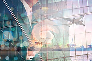 Double Exposure of Businessman writing and Port Cargo and Airplane