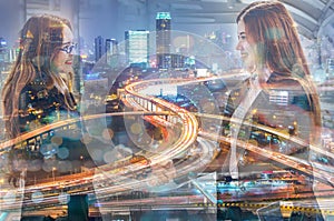 Double Exposure of Businesswomen handshake greeting and Expressway or Autobahn highway at Night