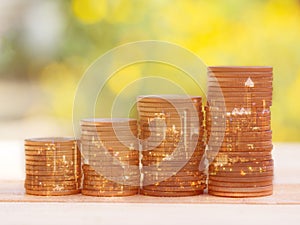 Double exposure of city and coin stack for business finance and banking concept. Golden color coin stack in night city