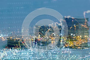 Double exposure of city and row of coins for finance and background