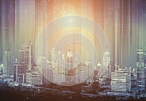 Double exposure of cityscape with connectivity technology icons.