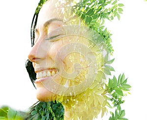Double exposure close up portrait of a beautiful smiling woman interwoven with leaves of a vibrant tropical tree
