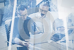 Double exposure concept.Team of business people making great work discussion in studio.Young bearded man showing