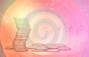 Double exposure condo of coins with archer background