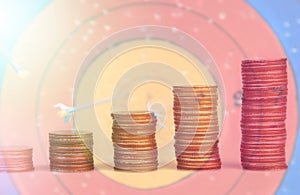 Double exposure condo of coins with archer background