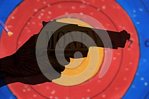 Double exposure condo of gun with coins background, Finance and banking concept