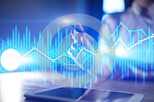 Double exposure economic charts and graphs on virtual screen. Online trading, Business and finance concept.