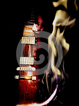 Double exposure electric guitar and fire