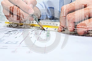 Double exposure engineer drawing and city