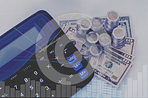 Double exposure of financial graph chart and piles of coins doll