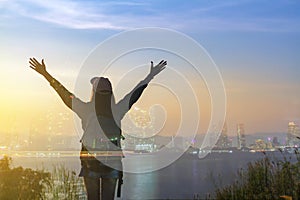 Double exposure Freedom traveler woman standing with raised arms and enjoying a beautiful nature and cheering young woman backpack