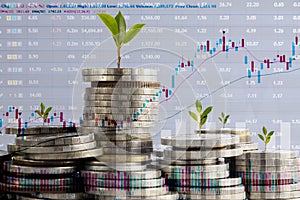 Double exposure of graph and rows of coins for finance and business concept