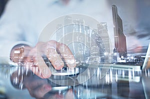 Double exposure of hand with mouse, business man working on computer online