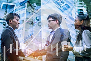 Double exposure handshake between businessman,successfully negotiated and achieved excellent commercial cooperation,tabbet and