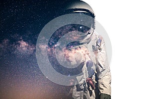 The double exposure image of the astronaut`s suit overlay with the milky way galaxy image. the concept of imagination, technology,