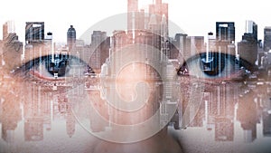 The double exposure image of the businessman`s eye overlay with cityscape image. The concept of modern life, futuristic, technolog