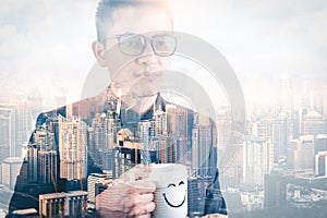 The double exposure image of the businessman seriously thinking during sunrise overlay with cityscape image. The concept of modern