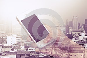 Double exposure image of woman using cellphone