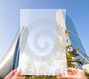 Double exposure make with hand holding white paper and height building, Business Trading concept