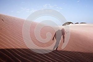 Double exposure of a man in the desert