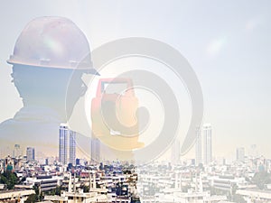 Double exposure man survey and civil engineer stand on ground working in a land building site over Blurred construction worker on