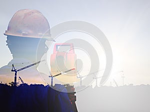 Double exposure man survey and civil engineer stand on ground working in a land building site over Blurred construction worker on