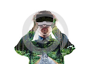 Double exposure. Man wearing virtual reality goggles. Forest. Tr