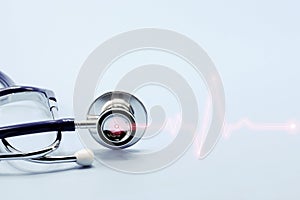 Double exposure of medical stethoscope and cardiogram isolated on light blue. Cardiac therapeutics assistance, pulse beat measure