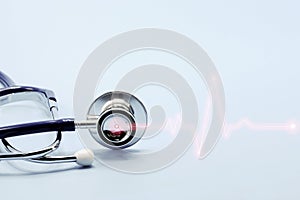 Double exposure of medical stethoscope and cardiogram isolated on light blue. Cardiac therapeutics assistance, pulse beat measure photo