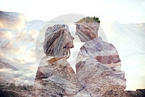 Double exposure man and woman couple hugging with mountains in background. Mountains inside couple in love. Lovers look at each