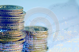 Double exposure of money coins with cityscape