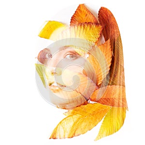 Double exposure portrait of beautiful young redheaded woman and fall leaves isolated on white background. Autumnal seasonal