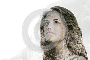 Double exposure portrait of beautiful young woman combined with