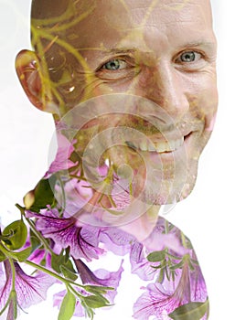 A double exposure portrait of a man combined with flowers on a white background