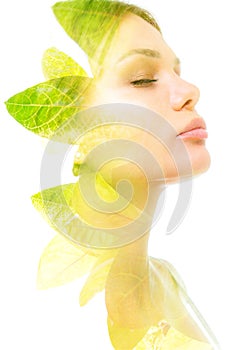 A double exposure portrait of a woman& x27;s profile with her eyes closed combined with a photo of green leaves of a plant