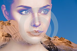 Double exposure portrait of young beautiful woman and mountains.