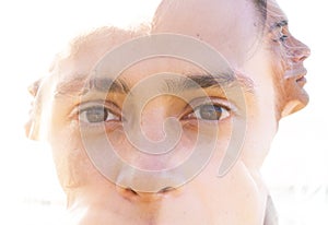 Double exposure portrait of a young fit man, pensive yet relaxed