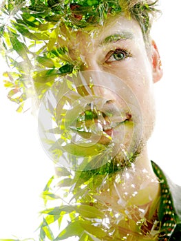 A double exposure portrait of a young man with a disappearing effect
