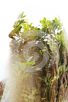 A double exposure profile of an old man with a beard disappearing at the top