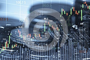 Double exposure of row coins city scape and stock market graph chart for economy and finance banking concept